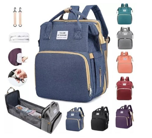Mochila Mudador 2 en 1 | Puerto USB | Colchoneta Cambiador Incluida | Morado, Rojo y Azul